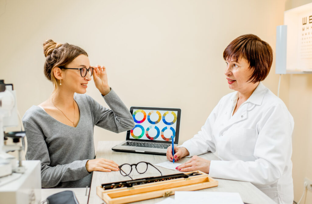 Optometrist with patient trying on EnChroma Lenses to help with color blindness