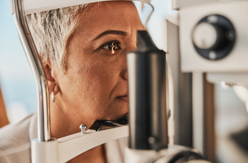 Close-up of a senior woman undergoing a slit-lamp exam.