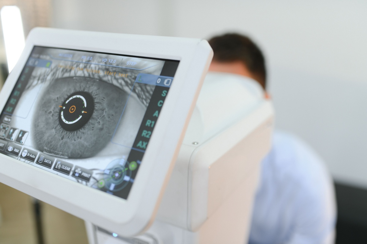 Monitor displaying detailed retinal imaging scan during comprehensive eye examination at optometry clinic.